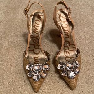 Tan rhinestone sling back heels.